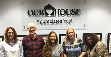The Smile Arkansas team volunteering at the Our House shelter.