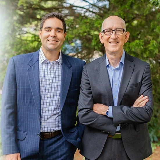 Dr. Jahon Zehtaban and Dr. Lee Wyant of Smile Arkansas, standing together outdoors.